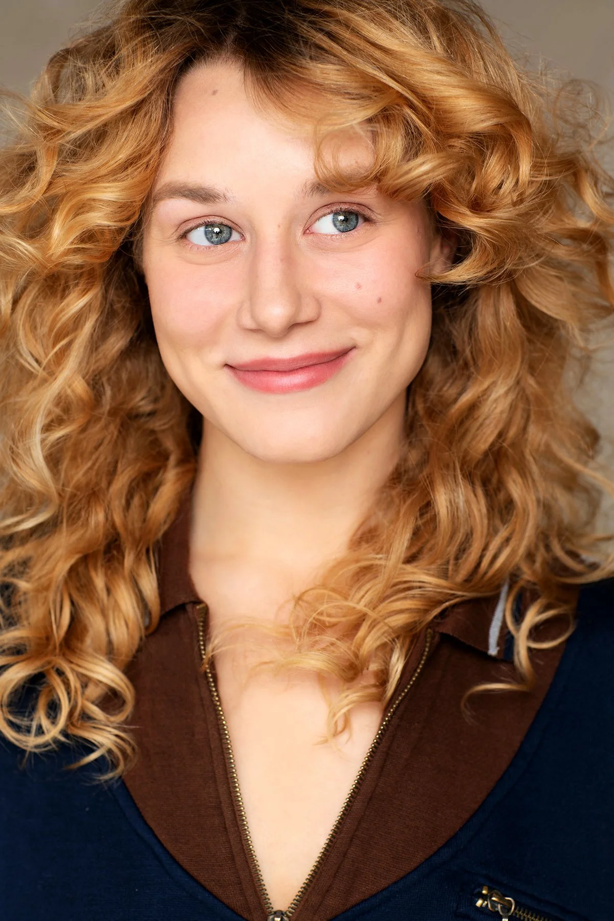 Corrynn Englerth smiling, with curly blonde hair